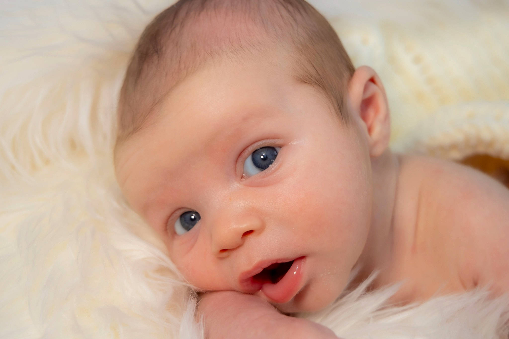 Titus is registered to the contest to win money with this photo: arm, baby, cheek, chin, dress, ear, eye, eyebrow, eyelash, face, finger, flash_photography, gesture, happy, head, human_body, iris, lip, nose, person