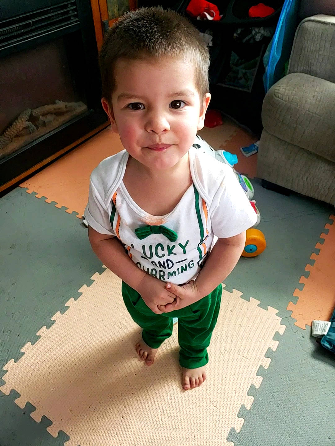 Andres joined the competition — help win amazing prizes! baby, baby_toddler_clothing, child, eye, face, floor, flooring, foot, fun, hair, happy, hardwood, head, person, room, sitting, sleeve, smile, t_shirt, toddler