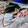 Jasmine joined the competition — help win amazing prizes! baby, infant, pacifier, blanket, green_blanket, gold_pattern, lying_down, fluffy_rug, portrait, face, eyes, hands, feet, indoor, home, textile, costume, sleeping, candid, child