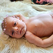 Jasmine joined the competition — help win amazing prizes! newborn, baby, infant, lying_down, headband, pink_beads, blanket, soft_texture, skin, cute, portrait, indoors, closeup, peaceful, resting, small_hands, diaper, sleepy_eyes, baby_boy, cozy