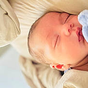 Sebastián joined the competition — help win amazing prizes! newborn, baby, sleeping, infant, portrait, face, closed_eyes, bed, bedding, blanket, cream, blue, peaceful, indoors, close_up, resting, soft_light, cozy, photography, child