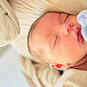 newborn, baby, sleeping, infant, portrait, face, closed_eyes, bed, bedding, blanket, cream, blue, peaceful, indoors, close_up, resting, soft_light, cozy, photography, child