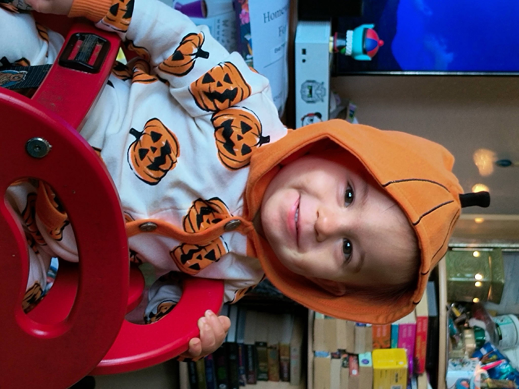 Artemis is registered to the contest to win money with this photo: animation, auto_part, automotive_tire, automotive_wheel_system, blue, child, costume, fashion_accessory, fun, happy, hat, headgear, headwear, joy, leisure, machine, orange, person, personal_protective_equipment, recreation