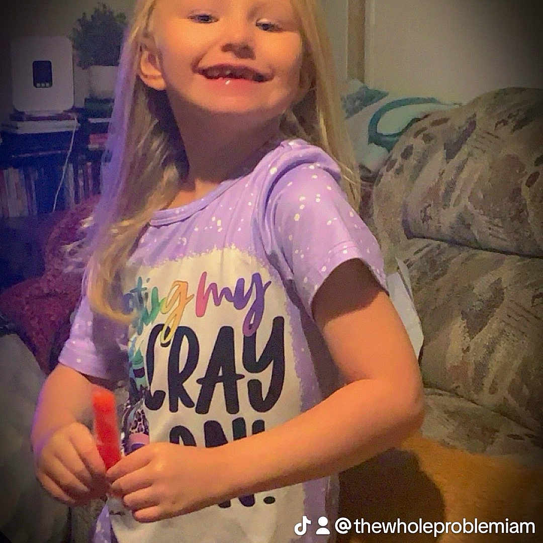 Raeleigh joined the competition — help win amazing prizes! architecture, blonde, building, child, clothing, couch, cushion, face, female, furniture, girl, hair, head, homedecor, indoors, livingroom, person, photography, portrait, t_shirt