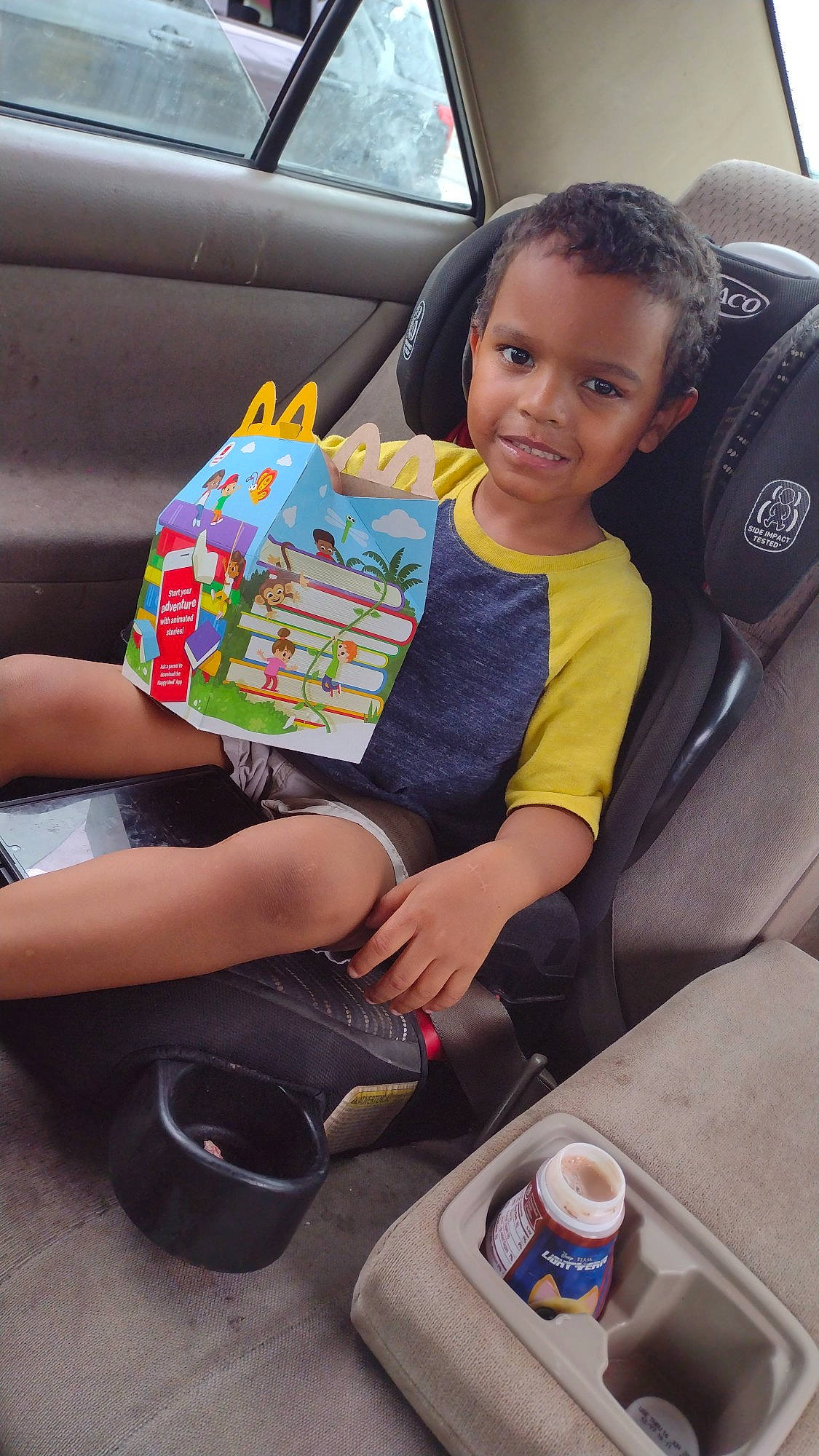Josiah is registered to the contest to win money with this photo: aluminum_can, automotive_design, car, car_seat, car_seat_cover, child, comfort, finger, fun, head_restraint, joy, lap, leisure, motor_vehicle, person, product, steering_wheel, thigh, tin_can, toddler
