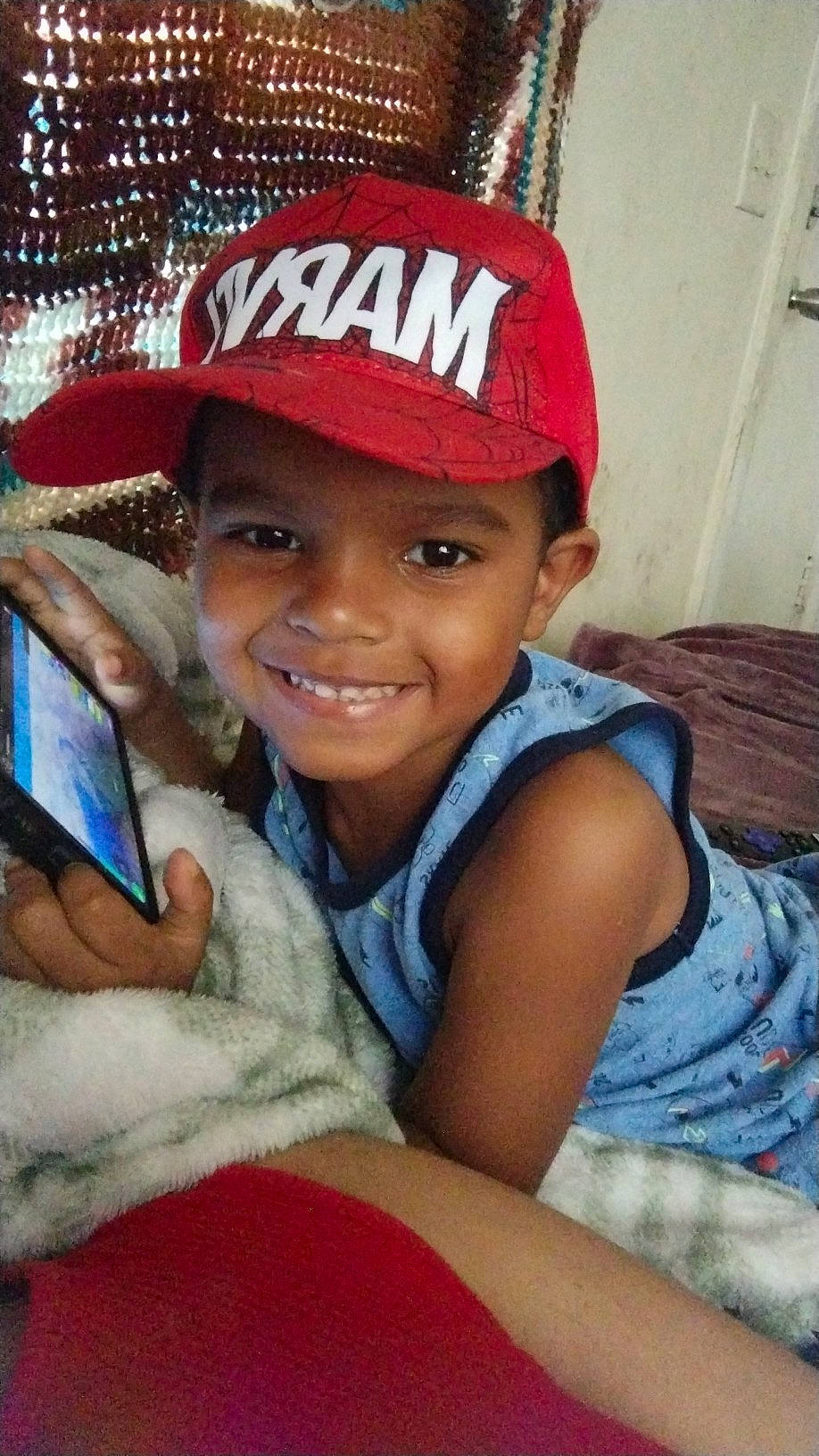 Josiah joined the competition — help win amazing prizes! baseball_cap, cap, child, chin, communication_device, fashion_accessory, forehead, fun, gesture, happy, headwear, human_body, joy, lip, mouth, person, portable_communications_device, skin, smile, t_shirt