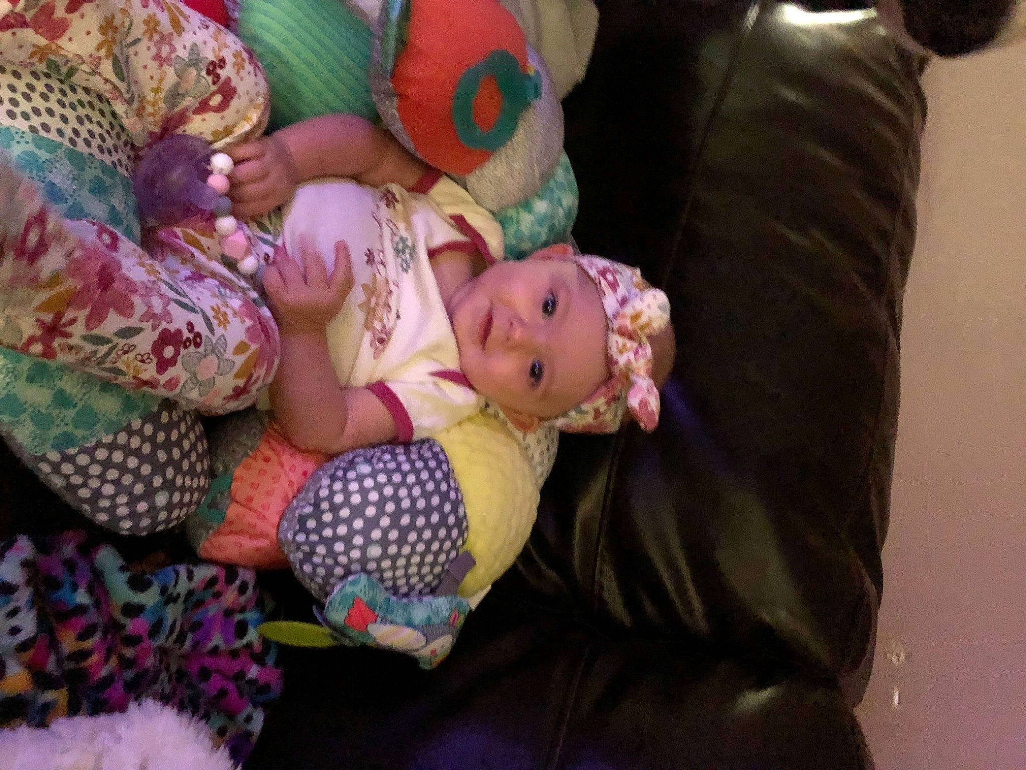 Kashlyn joined the competition — help win amazing prizes! baby, baby_products, child, comfort, couch, doll, eye, fawn, fun, headwear, lap, linens, magenta, pattern, person, pink, purple, room, sitting, toddler
