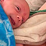 Waylon is registered to the contest to win money with this photo: newborn, baby, blanket, blue, smile, sleeping, face, hand, skin, towel, resting, comfort, closeup, infant, cute, cozy, soft, peaceful, portrait, child