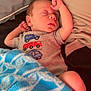 Waylon joined the competition — help win amazing prizes! baby, sleeping, blanket, blue, pillow, bed, infant, clothing, grey_shirt, vehicle_print, peaceful, resting, cozy, comfort, indoor, child, portrait, cute, soft, relaxation