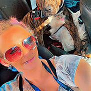 King joined the competition — help win amazing prizes! accessory, bag, brindle_dog, car, casual, clothing, collar, dog, interior, leash, person, pet, piercing, portrait, seat, seatbelt, selfie, sunglasses, sunlight, tattoo