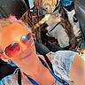 accessory, bag, brindle_dog, car, casual, clothing, collar, dog, interior, leash, person, pet, piercing, portrait, seat, seatbelt, selfie, sunglasses, sunlight, tattoo