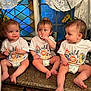 baby, toddler, child, kitchen, countertop, matching_clothing, diaper, white_shirt, wild_one, indoor, cute, playful, curious, person, family, window, lace_curtains, stained_glass, adult_partial, utensils