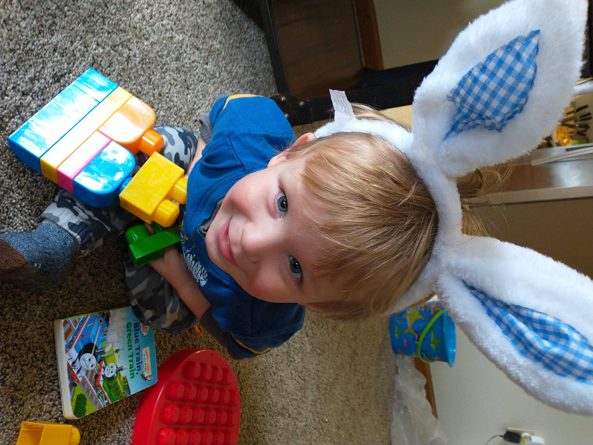 Porter is registered to the contest to win money with this photo: baby, baby_products, baby_toddler_clothing, baby_toys, blue, box, child, electric_blue, fun, happy, joy, leisure, person, plastic, play, product, recreation, room, smile, t_shirt