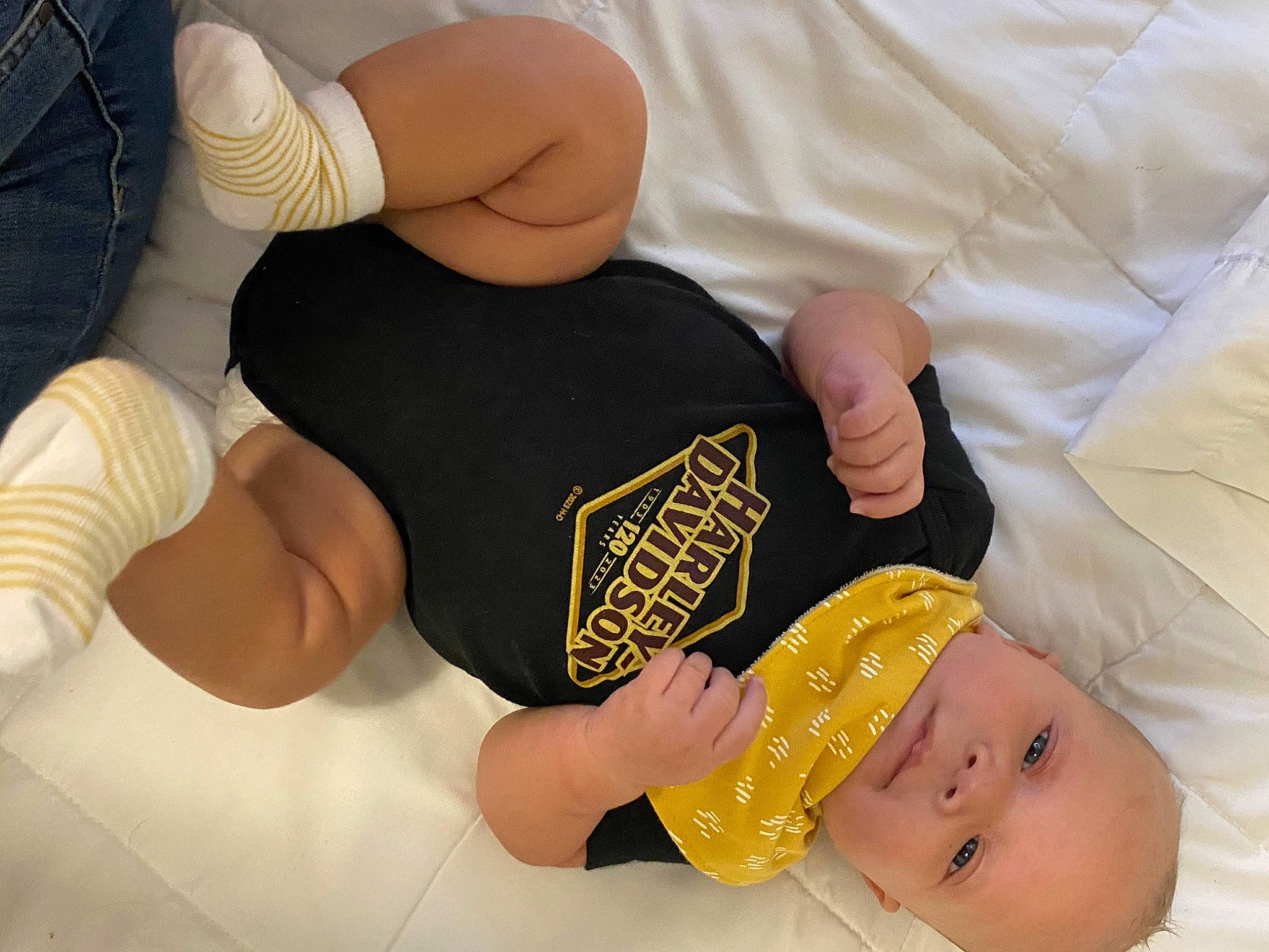 Raynell is registered to the contest to win money with this photo: baby, baby_toddler_clothing, child, clothing, comfort, elbow, finger, gesture, hand, happy, human_leg, knee, nail, person, skin, sportswear, thigh, thumb, toddler, wrist