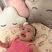 Valentina joined the competition — help win amazing prizes! baby, infant, smiling, pink_dress, headband, plush_pillow, cloud_pillow, moon_pillow, star_pillow, blanket, elephant_print, cute, child, happy, indoors, soft_toys, nursery, toddler, bedroom, sleepy_face