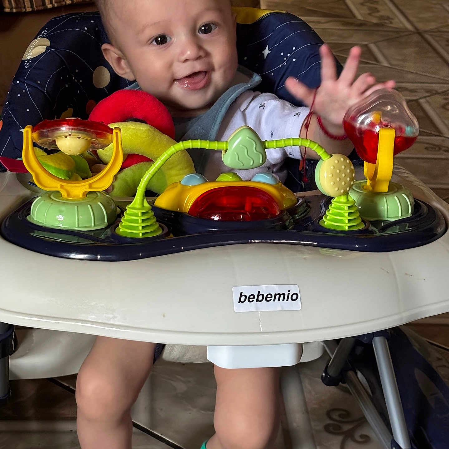 Jeremiah joined the competition — help win amazing prizes! baby, child, walker, toy, smile, indoor, floor, socks, face, person, play, seat, happy, cute, legs, hand, furniture, colorful, expression, home