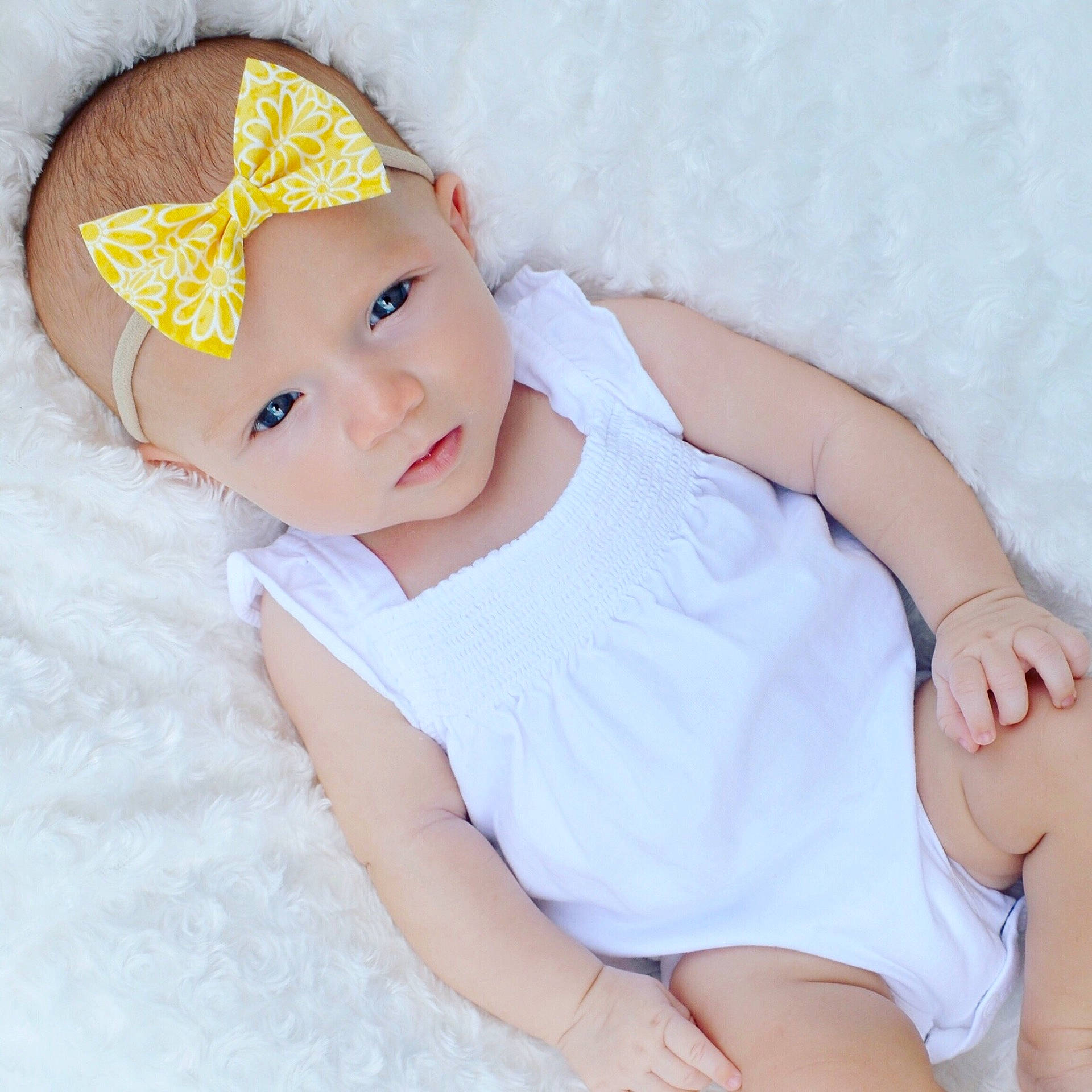 Emma is registered to the contest to win money with this photo: child, girl, hair_accessory, headgear, infant, material, person, product, textile, toddler