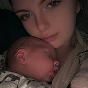 Ivy-Leigh is registered to the contest to win money with this photo: baby, sleeping, young_woman, face, closeup, cozy, penguin_pattern, blanket, soft_light, tender_moment, portrait, human, indoor, comfort, mother_and_child, peaceful, skin, cuddle, rest, warmth