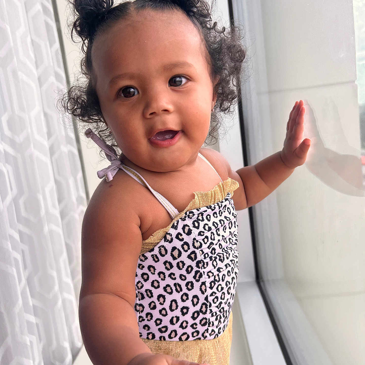 Kaylani joined the competition — help win amazing prizes! baby, babylaughing, blackhair, bodypart, clothing, dress, eveningdress, face, finger, formalwear, hair, hand, happy, head, person, photography, portrait, sitting, smile, window