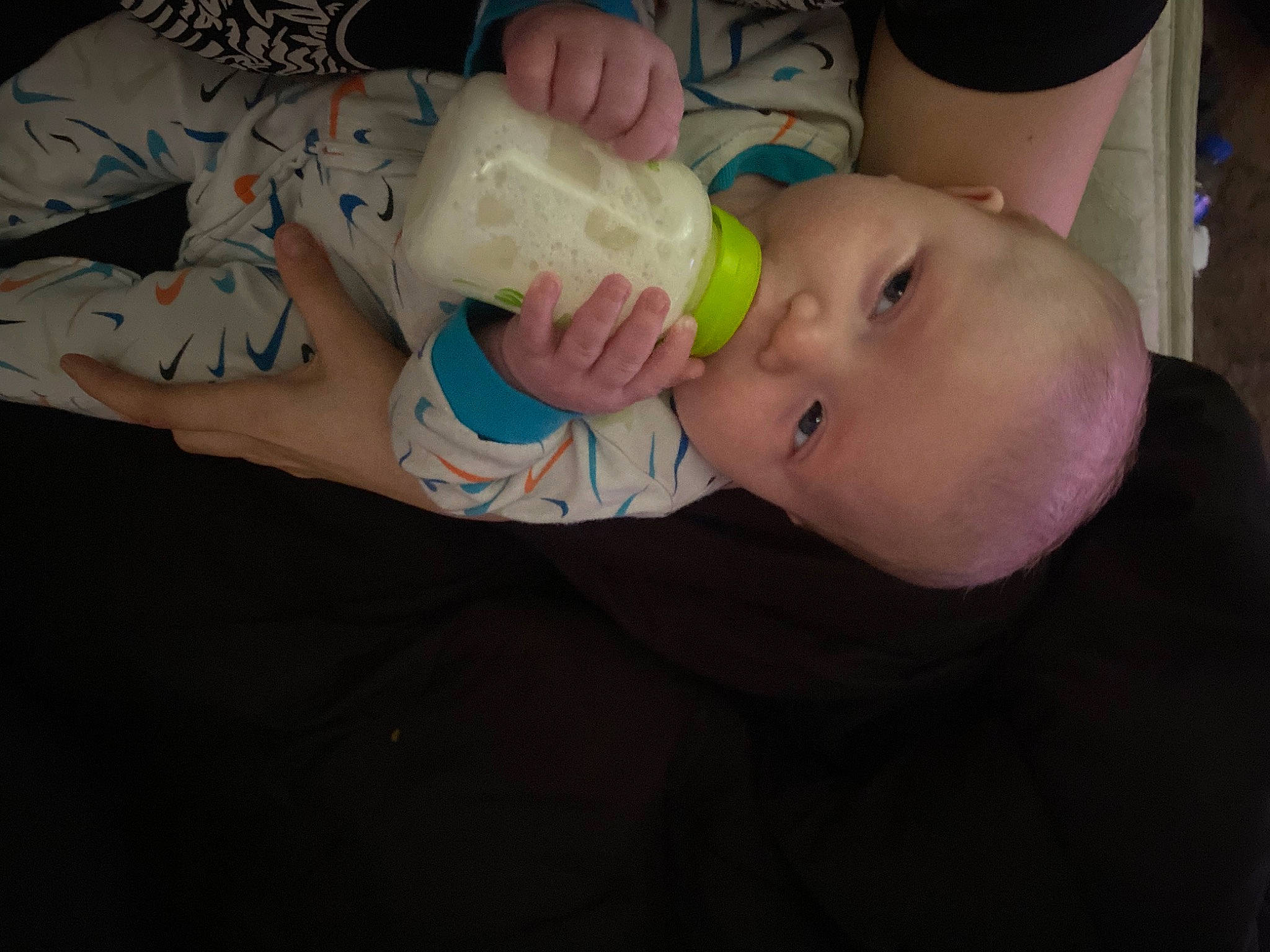 Josiah joined the competition — help win amazing prizes! baby, baby_bottle, baby_toddler_clothing, bottle, cheek, drinkware, ear, eyelash, face, finger, food, hand, head, human_body, infant_formula, mouth, nail, person, plastic_bottle, skin