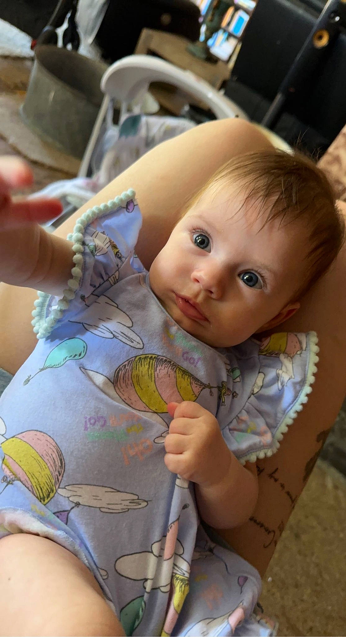 Aria is registered to the contest to win money with this photo: baby, chair, cheek, chest, child, doll, eye, finger, hand, head, human_leg, iris, mouth, person, skin, textile, thigh, thumb, toddler, toy