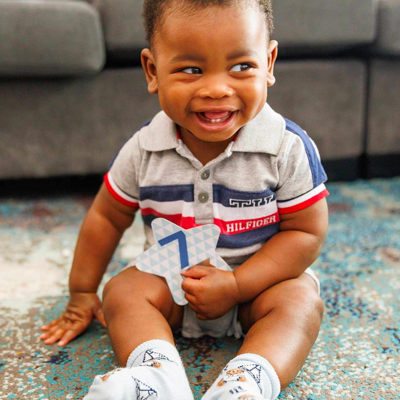 Zyaire joined the competition — help win amazing prizes! boy, child, clothing, couch, face, footwear, furniture, happy, head, hosiery, male, pants, person, photography, portrait, shoe, shorts, sitting, smile, sock