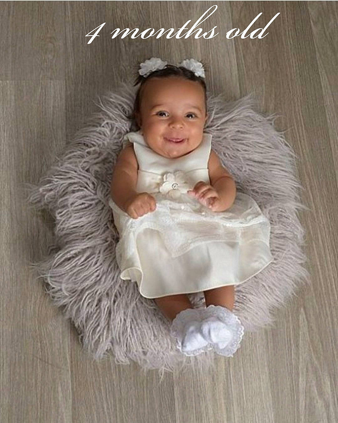 Elena is registered to the contest to win money with this photo: baby, baby_toddler_clothing, child, costume, dress, embellishment, event, fashion_accessory, flash_photography, hair_accessory, happy, headpiece, jewellery, joy, peach, person, photo_caption, picture_frame, sitting, smile