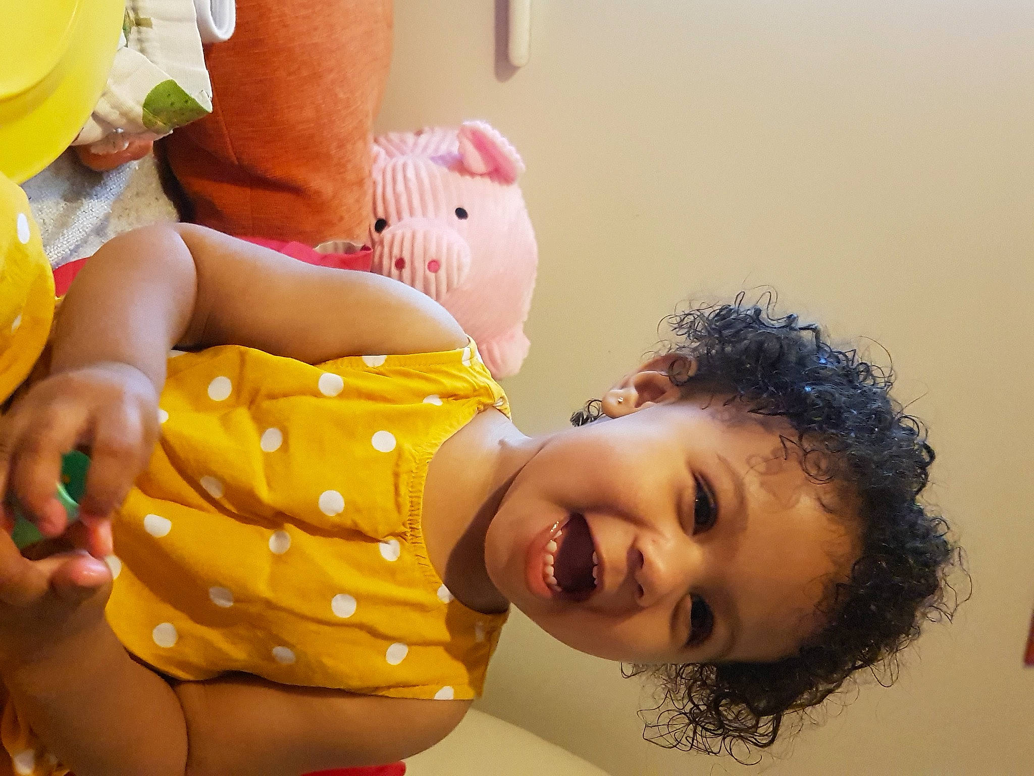 Elise is registered to the contest to win money with this photo: abdomen, baby, child, eyelash, fun, gesture, happy, hat, human_body, interaction, leisure, mouth, person, plant, play, room, skin, smile, toddler, trunk