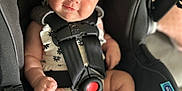 Aleena joined the competition — help win amazing prizes! baby, car_seat, child, infant, headband, smile, blue_eyes, straps, black_clothing, cute, skin, foot, hand, portrait, sitting, indoor, safety, seat_belt, clothing, person