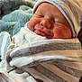 baby, newborn, sleeping, wrapped, blanket, striped, hat, cozy, soft, fuzzy, warm, indoor, portrait, cute, infant, peaceful, smile, face, child, holiday