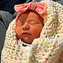Harper is registered to the contest to win money with this photo: baby, newborn, sleeping, blanket, knitted, pink_bow, headband, face, infant, cute, soft, closeup, wrapped, resting, peaceful, skin, child, portrait, warm, cozy