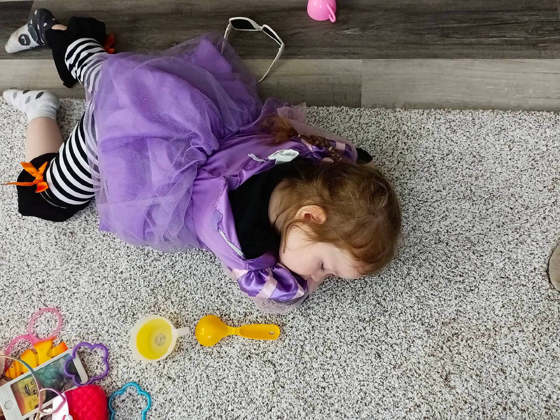 Harmony is registered to the contest to win money with this photo: baby, baby_toddler_clothing, child, floor, flooring, fun, happy, magenta, person, play, purple, room, sitting, stuffed_toy, toddler, toy, toy_vehicle, violet, yellow
