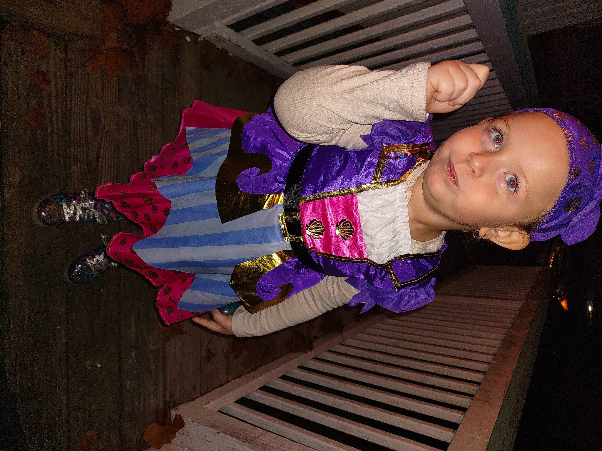 Sophia is registered to the contest to win money with this photo: baby_toddler_clothing, child, costume, electric_blue, fun, hardwood, headwear, magenta, pattern, person, pink, purple, smile, toddler, wood