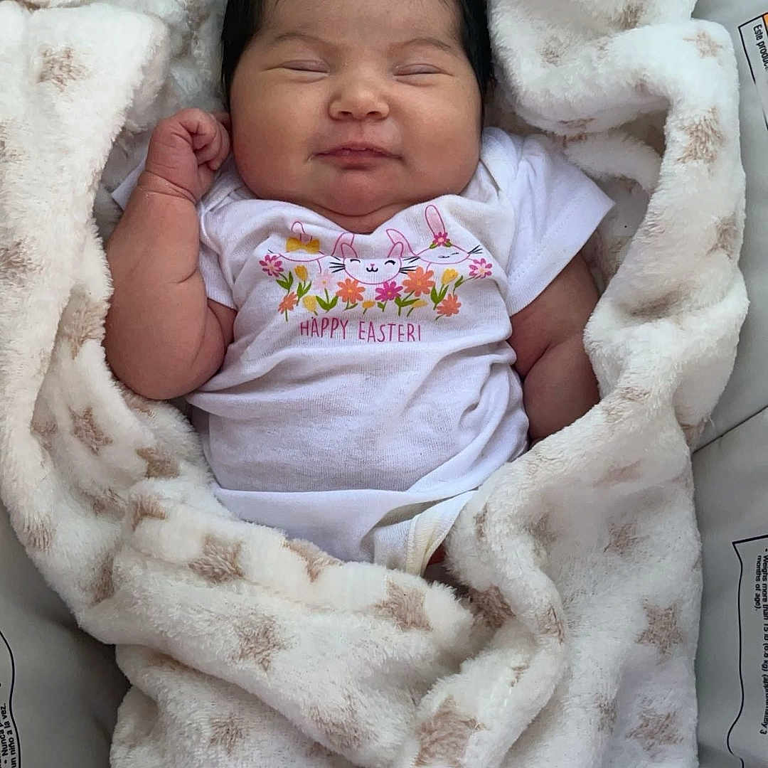 Alejandra is registered to the contest to win money with this photo: baby, bed, bedroom, blanket, clothing, cushion, face, furniture, glove, head, homedecor, indoors, newborn, person, photography, portrait, quilt, room, sleeping, towel