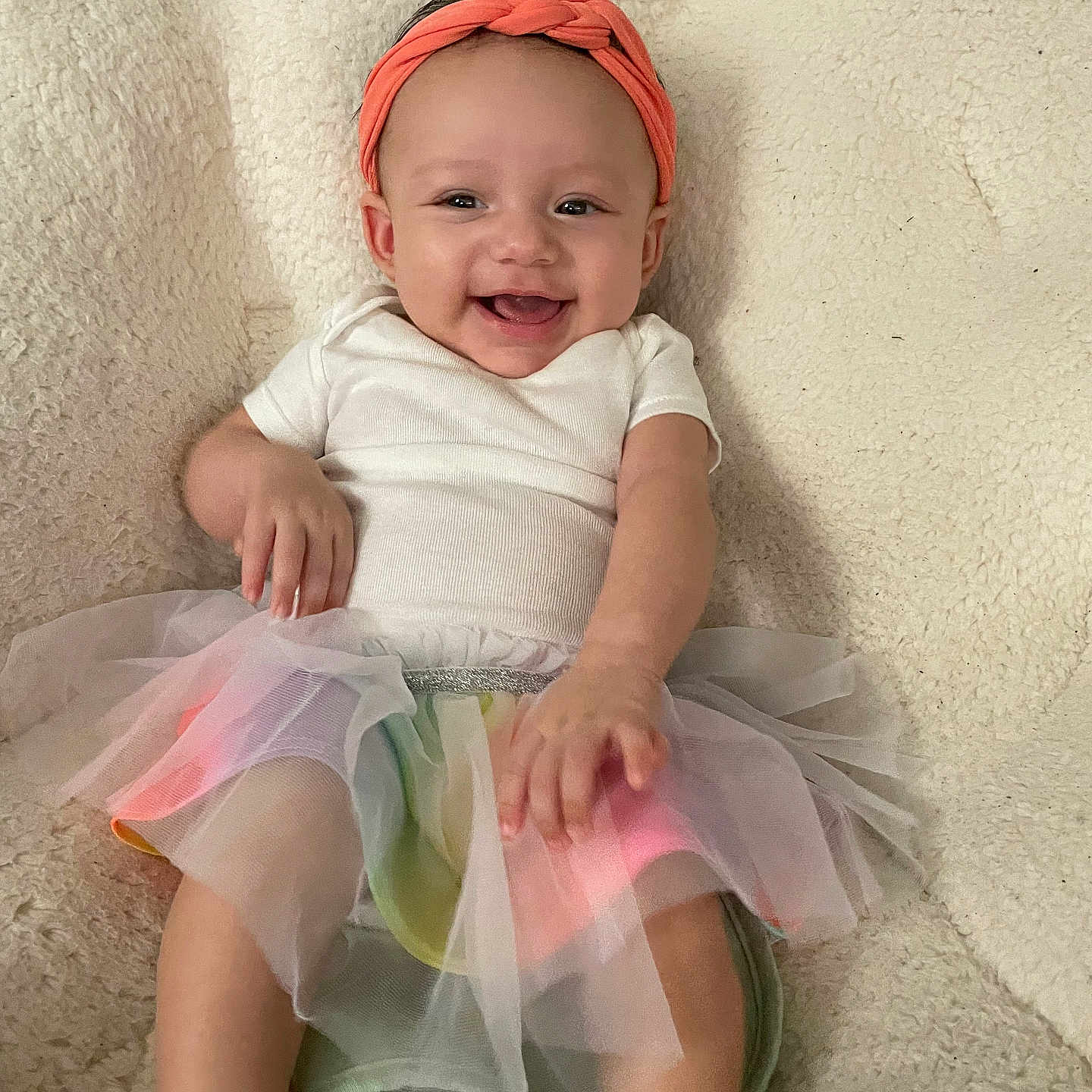 Zavaya is registered to the contest to win money with this photo: accessories, baby, bonnet, cap, clothing, costume, dress, face, happy, hat, head, hosiery, laughing, person, photography, portrait, sitting, skirt, smile, sock
