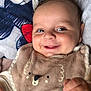 Aaron a rejoint le concours — aidez-le/la à gagner de superbes lots ! baby, bib, blanket, child, closeup, clothing, cute, face, hand, happy, head, infant, lying_down, pacifier, pattern, portrait, skin, smiling, soft, young