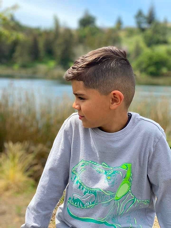 Jayson joined the competition — help win amazing prizes! child, fun, grass, grassland, happy, lake, landscape, leisure, neck, people_in_nature, person, plant, recreation, reservoir, shoulder, sitting, sky, sleeve, t_shirt, tree