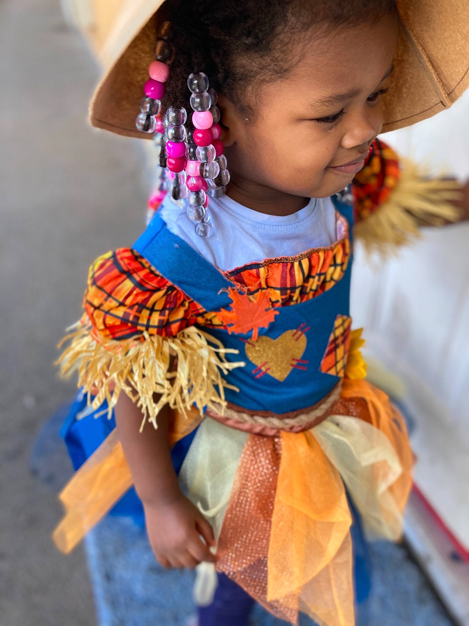 Alaska is registered to the contest to win money with this photo: baby_toddler_clothing, child, day_dress, electric_blue, entertainment, event, face, fashion_accessory, fashion_design, fun, hairstyle, happy, hat, headgear, orange, person, skin, sleeve, snapshot, sun_hat