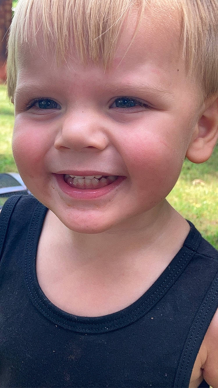 Judson is registered to the contest to win money with this photo: cheek, cool, ear, eyebrow, eyelash, forehead, grass, happy, human_body, iris, jaw, joy, lip, mouth, neck, nose, person, skin, smile, summer