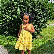 Anias joined the competition — help win amazing prizes! child, girl, yellow_dress, outdoor, grass, bush, smile, curly_hair, hair_clips, sunny, sandals, greenery, standing, nature, happy, portrait, person, summer, cute, fashion