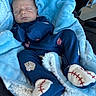 newborn, baby, sleeping, infant, face, portrait, car_seat, blanket, blue_blanket, blue_clothing, baseball, baseball_socks, socks, bundled, cozy, indoors, vehicle, peaceful, photography, child