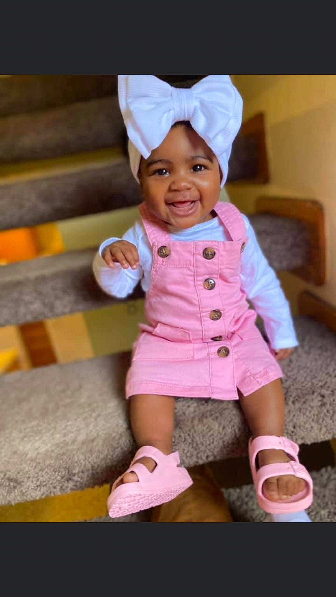 Kamorah is registered to the contest to win money with this photo: baby, baby_products, baby_toddler_clothing, cap, cheek, child, clothing, fashion_accessory, happy, headwear, joy, leg, magenta, pattern, person, pink, purple, sitting, skin, sleeve