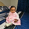 toddler, child, girl, pink_dress, flower_hair_accessory, smiling, sitting, bed, bedroom, blue_bedding, white_shoes, happy, cute, portrait, indoor, person, young_child, fashion, home, decor