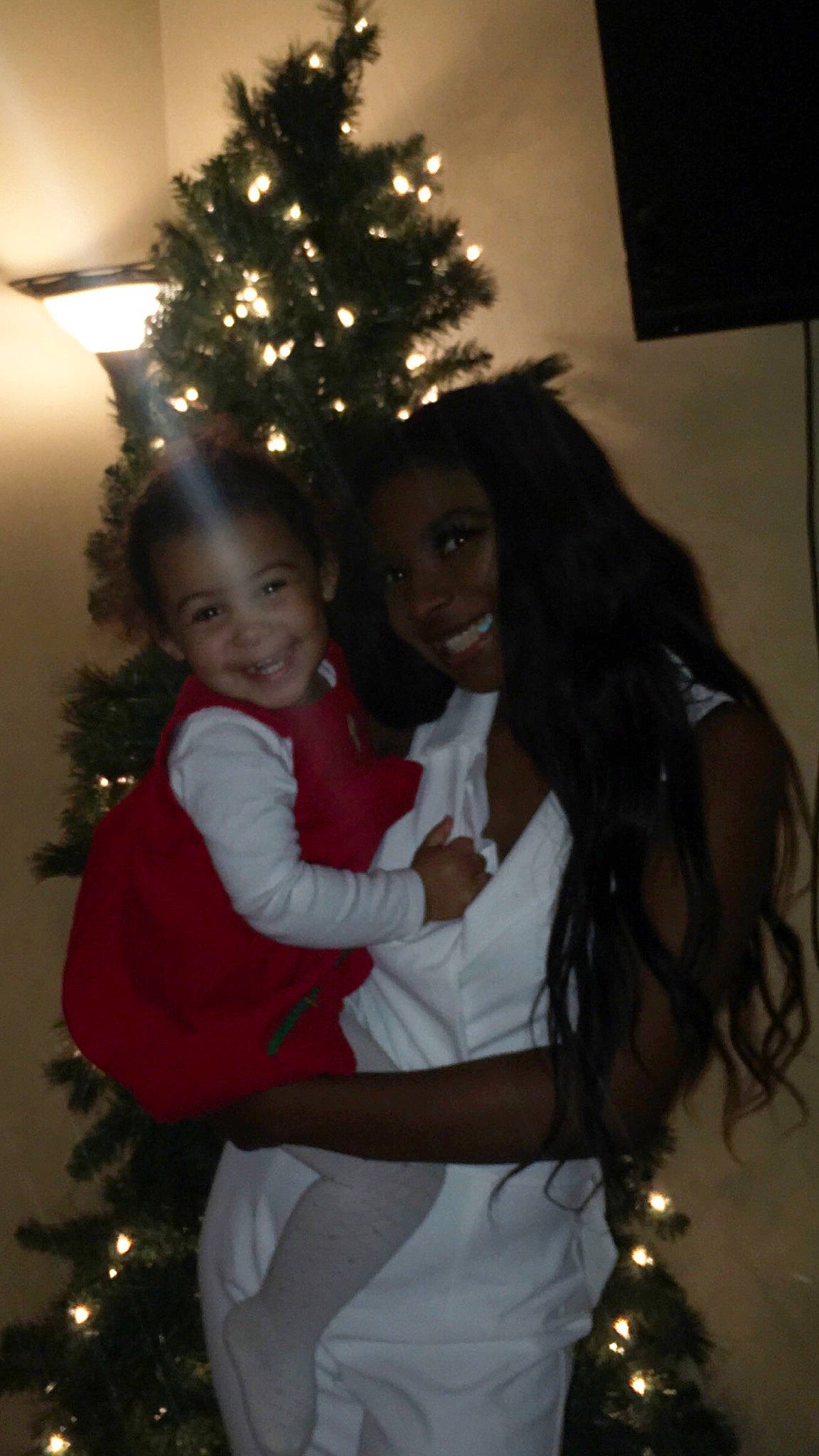 Genevieve is registered to the contest to win money with this photo: christmas, christmas_decoration, christmas_eve, christmas_ornament, christmas_tree, event, fun, holiday, interior_design, joy, person, smile, tradition, tree, under_exposed