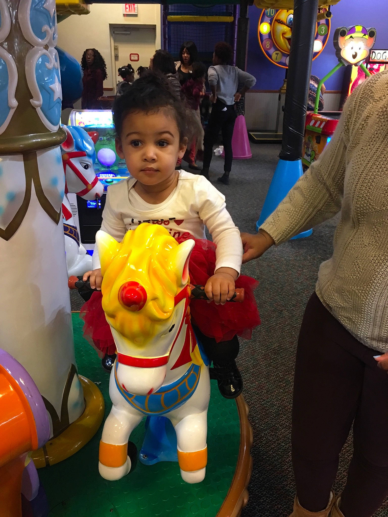 Genevieve is registered to the contest to win money with this photo: child, costume, fun, games, mascot, person, play, room, smile, snapshot, toddler, world, yellow