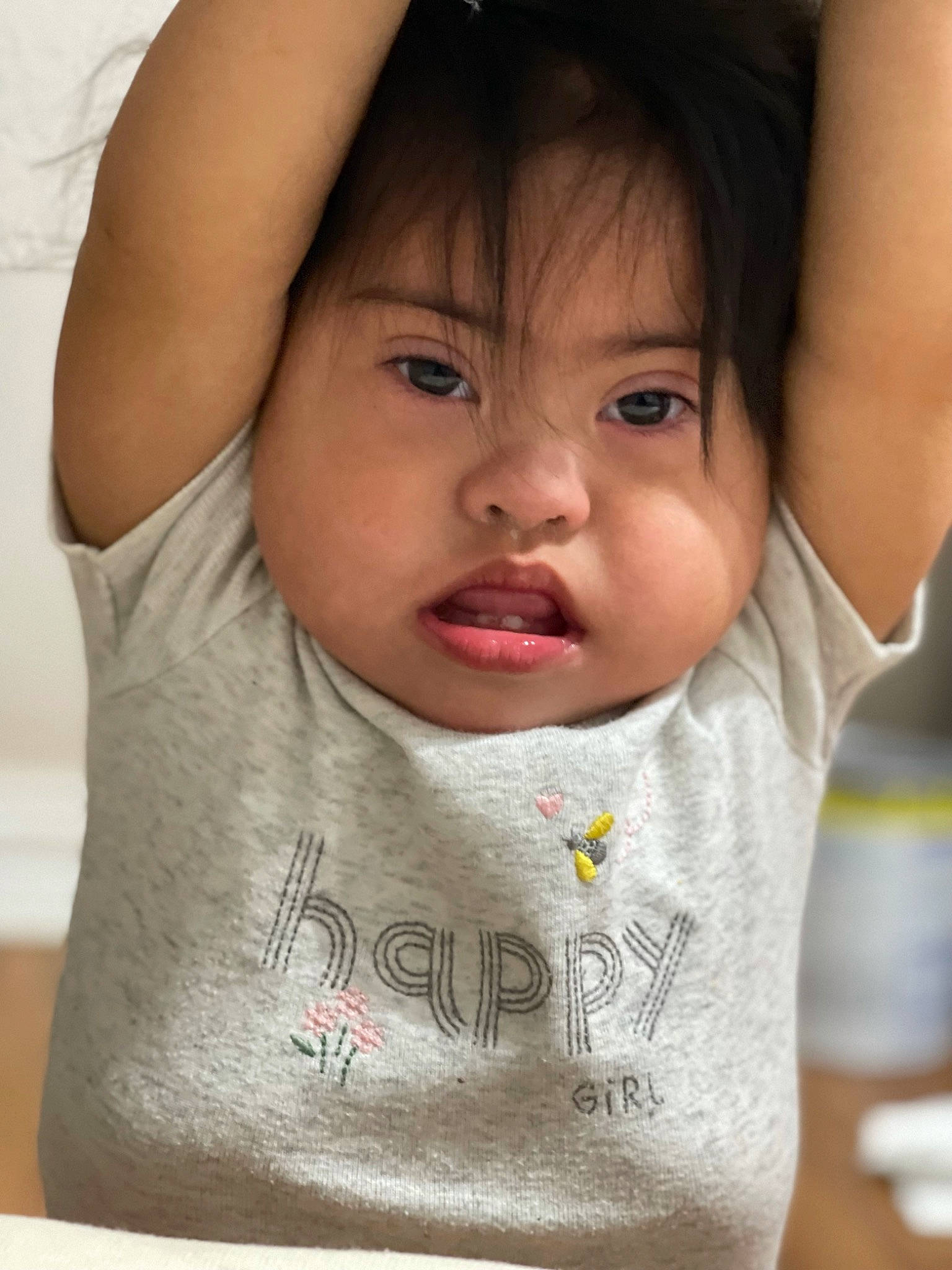 Ofelia is registered to the contest to win money with this photo: arm, baby_toddler_clothing, cheek, chin, dress, ear, eyebrow, eyelash, face, finger, forehead, gesture, happy, iris, lip, mouth, neck, nose, person, skin