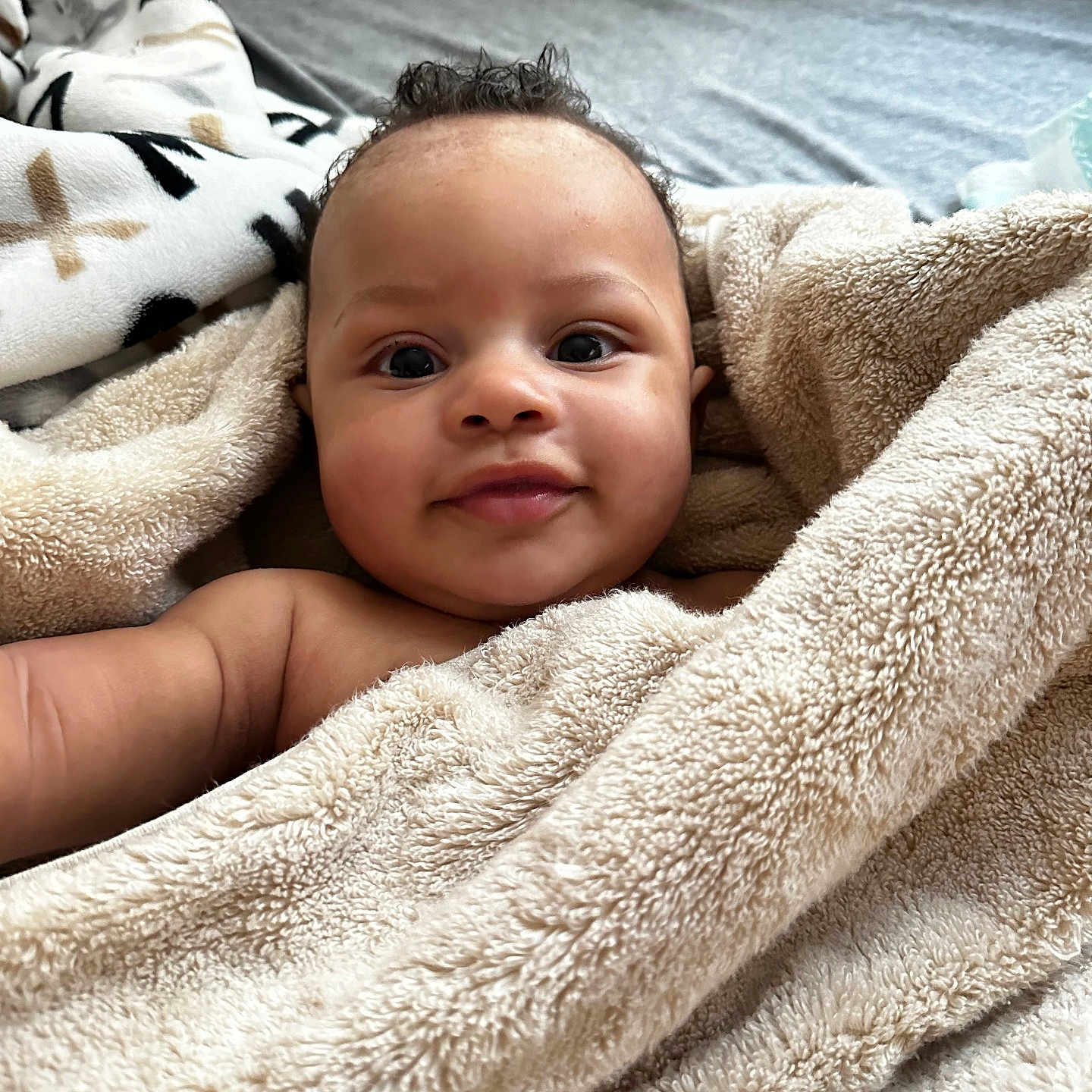 Chayse joined the competition — help win amazing prizes! baby, bed, bedroom, blanket, face, furniture, happy, head, indoors, newborn, person, photography, portrait, quilt, room, smile, towel