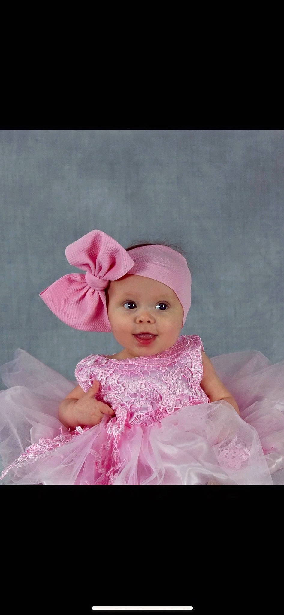 Aurora joined the competition — help win amazing prizes! baby, baby_toddler_clothing, child, costume_accessory, day_dress, dress, embellishment, fashion_accessory, hair_accessory, happy, headpiece, headwear, magenta, pattern, peach, person, petal, pink, ruffle, sleeve