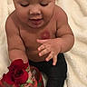Louie joined the competition — help win amazing prizes! baby, child, rose, flower, valentines_day, heart_shaped_box, chocolates, red, curly_hair, skin, hand, black_pants, blanket, sitting, portrait, cute, infant, love, holiday, gift
