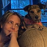 Sandy is registered to the contest to win money with this photo: animal, casual, clothing, companion, couch, cozy, dog, evening, furniture, home, human, indoor, looking_away, pet, portrait, relaxed, soft_light, thoughtful, window, woman